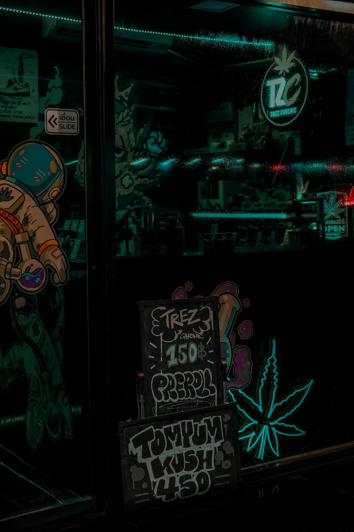 A window with a sign that says, cannabis